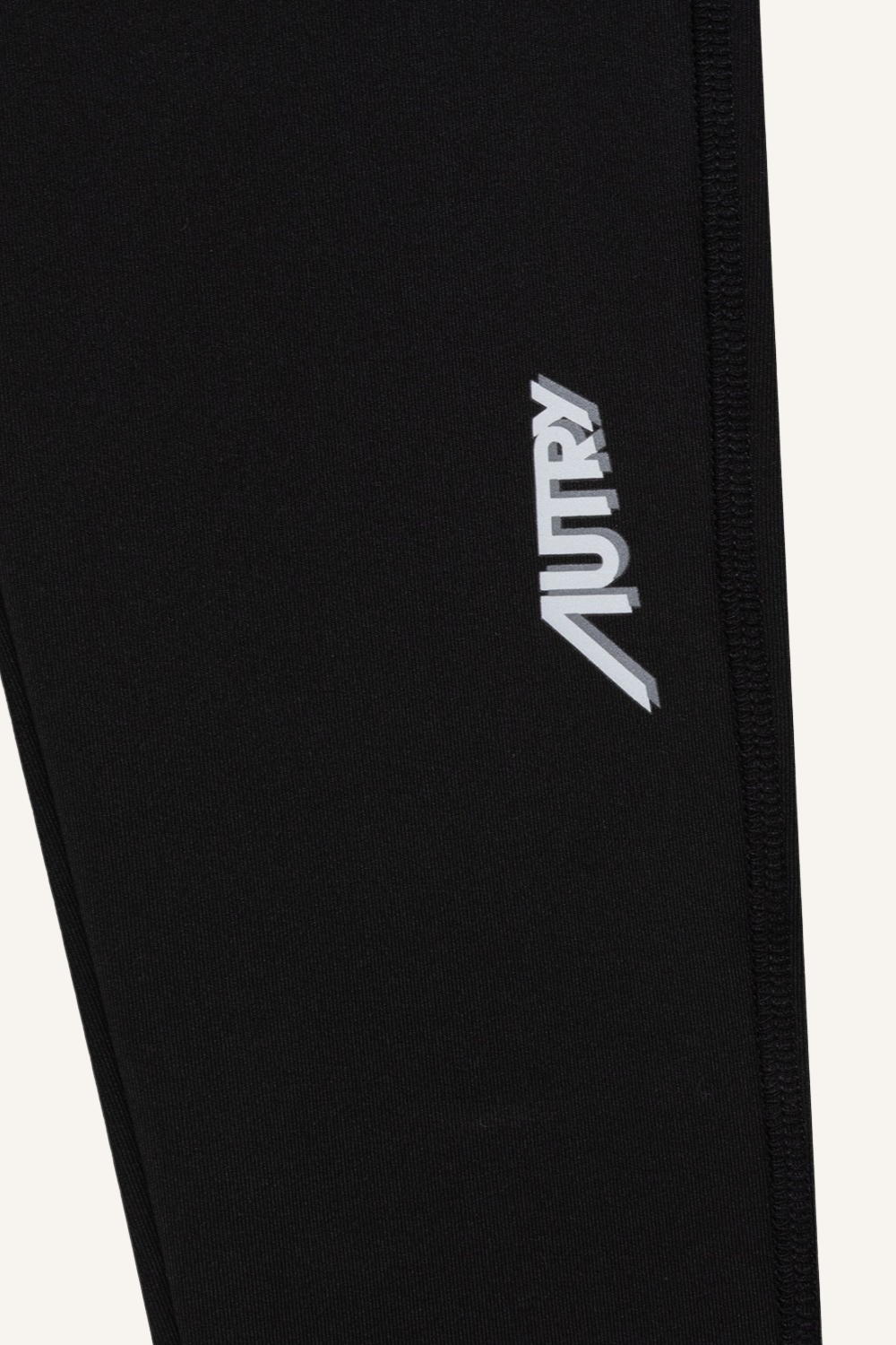 Schwarze Leggings mit hohem Bund und kleinem weißen Logo am linken Bein aus technischem, elastischem Gewebe